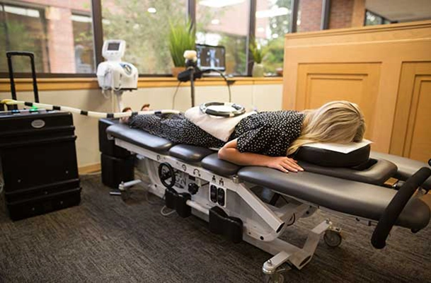 Chiropractic Loveland CO Patient On Decompression Table